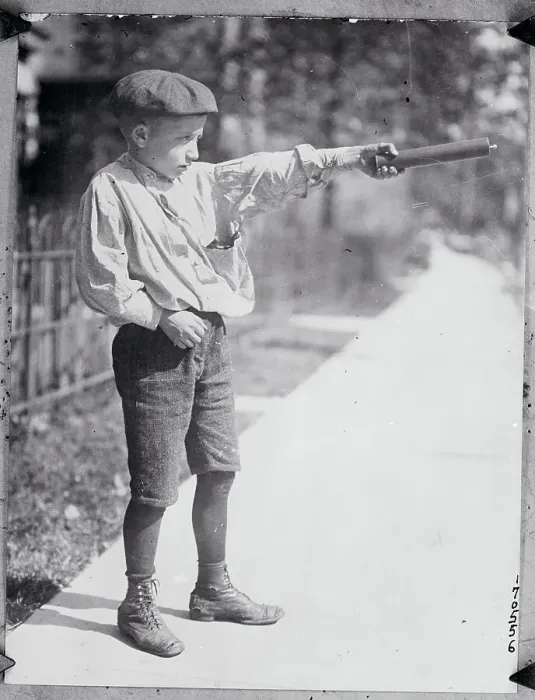 Framed Print : Boy Holding a Firecracker Framed Print : Boy Holding a Firecracker