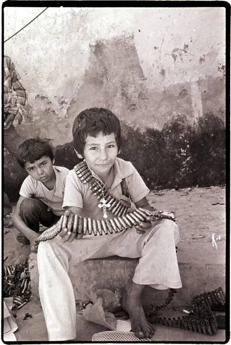Framed Print : Boy Holding Used Cartridge String