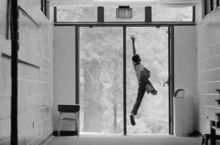 Framed Print : Boy Jumping in Doorway Framed Print : Boy Jumping in Doorway
