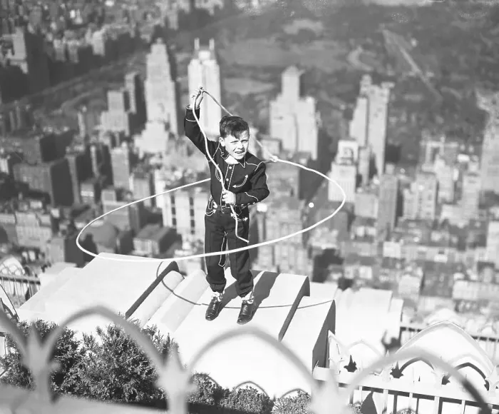 Framed Print : Boy on Ledge Twirling a Lasso Framed Print : Boy on Ledge Twirling a Lasso