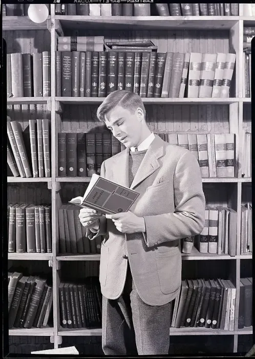 Framed Print : Boy in Library Reading Book Framed Print : Boy in Library Reading Book