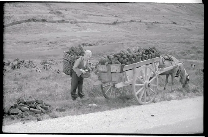 Framed Print : Boy Loading Peat into Wagon Framed Print : Boy Loading Peat into Wagon