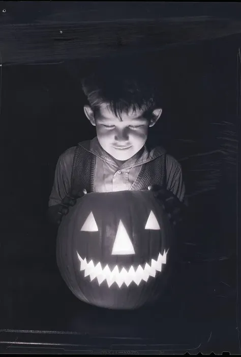 Framed Print : Boy Looking into Jack O'Lantern Framed Print : Boy Looking into Jack O'Lantern