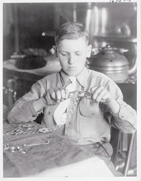 Framed Print : Boy Making Novelty Chains Framed Print : Boy Making Novelty Chains