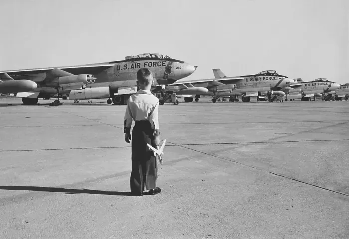 Framed Print : Boy Observing Bombers at Naval Base