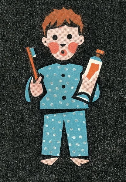 Boy in pajamas brushing teeth