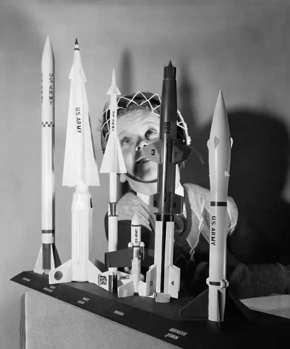 Framed Print : Boy Playing With Space Age Rocket Toys Framed Print : Boy Playing With Space Age Rocket Toys