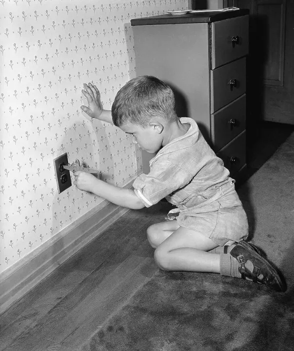 Framed Print : Boy Putting Toy into an Outlet Framed Print : Boy Putting Toy into an Outlet
