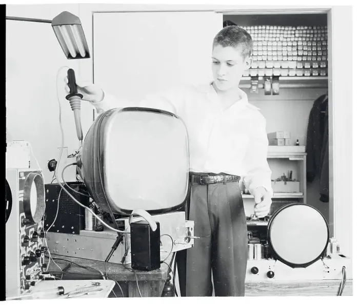 Framed Print : Boy Repairing a TV Framed Print : Boy Repairing a TV