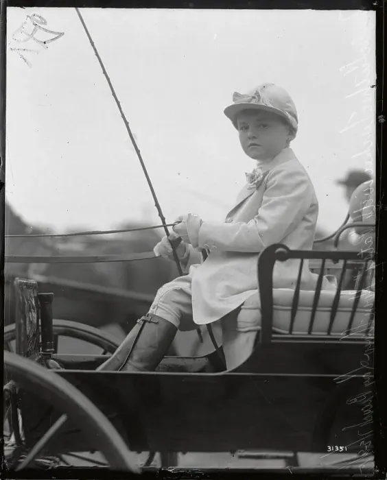 Framed Print : Boy Seated In Cart In Riding Gear Framed Print : Boy Seated In Cart In Riding Gear
