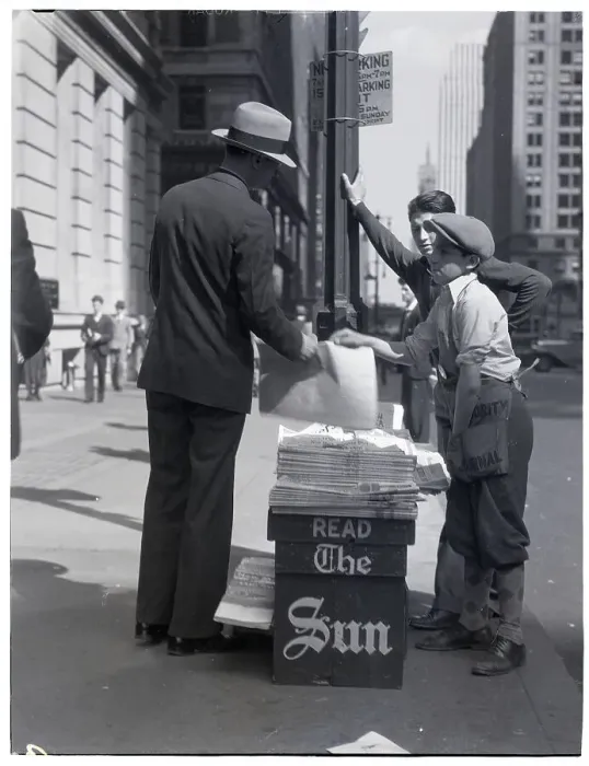 Framed Print : Boy Selling Newspapers on Sidewalk Framed Print : Boy Selling Newspapers on Sidewalk