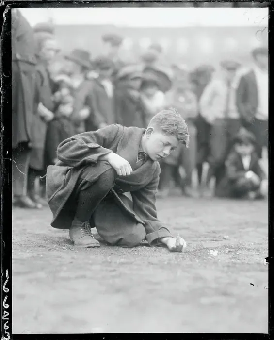 Framed Print : Boy Shooting Marbles Framed Print : Boy Shooting Marbles