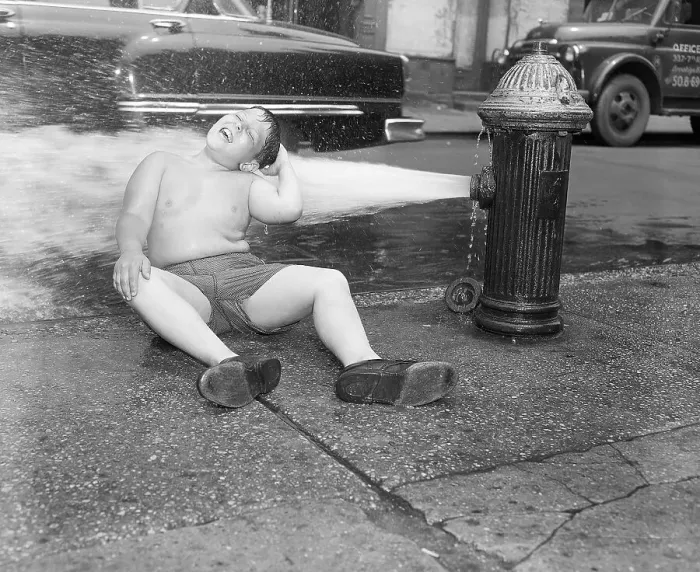 Framed Print : Boy Sits on Sidewalk in Fire Hydrant Framed Print : Boy Sits on Sidewalk in Fire Hydrant