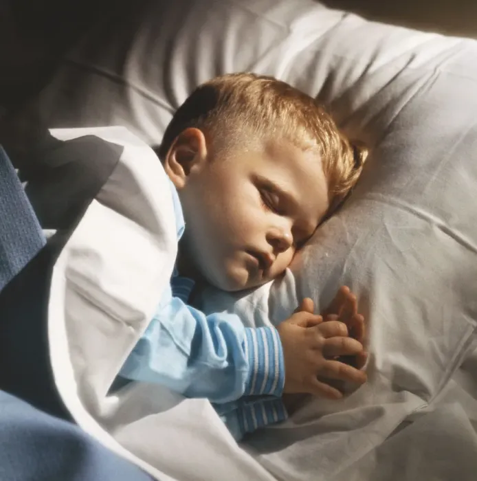 Framed Print : Boy sleeping on bed