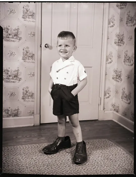 Framed Print : Boy Standing in Oversized Shoes Framed Print : Boy Standing in Oversized Shoes