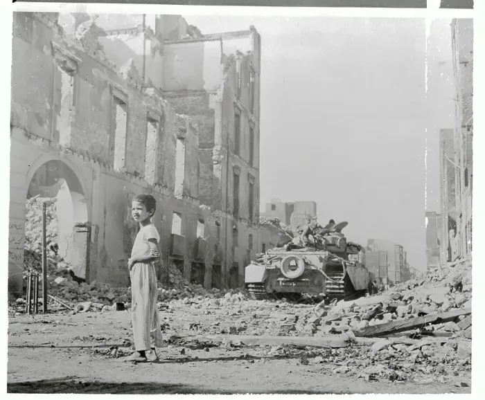Framed Print : Boy Standing in War Torn Street