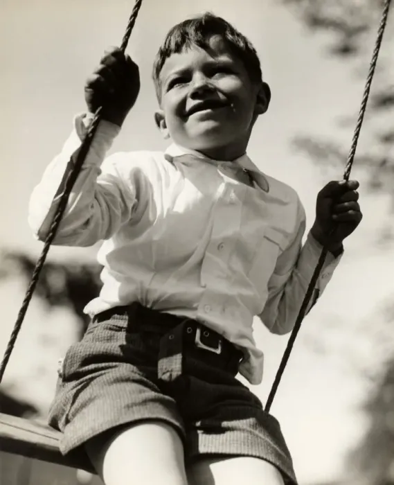 Framed Print : Boy in swing outdoors Framed Print : Boy in swing outdoors
