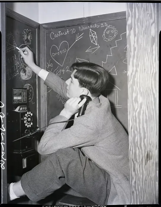 Framed Print : Boy in Telephone Booth Doodling on Blackboard Framed Print : Boy in Telephone Booth Doodling on Blackboard