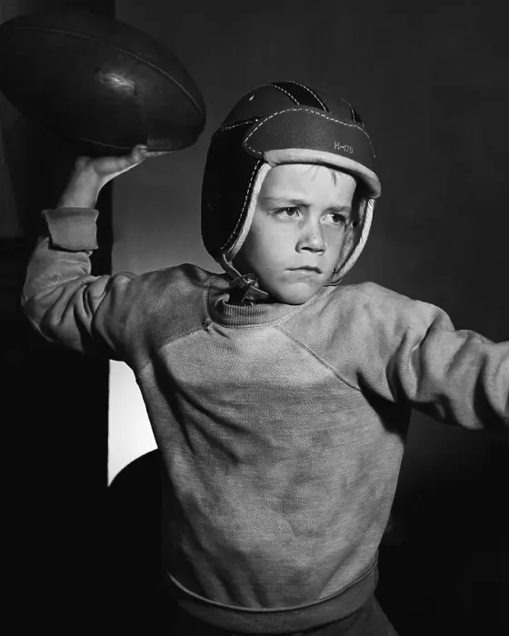 Framed Print : Boy Throwing a Football Framed Print : Boy Throwing a Football