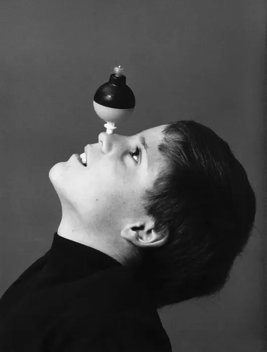 Framed Print : Boy with Toy Spinning on Nose Framed Print : Boy with Toy Spinning on Nose