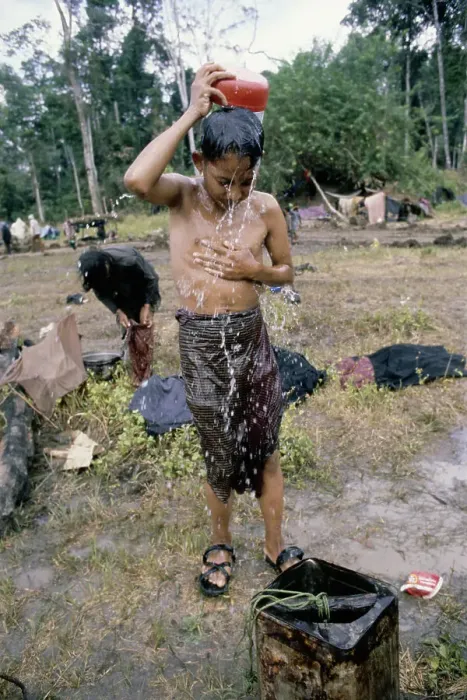 Framed Print : Boy Washing At Refugee Camp Framed Print : Boy Washing At Refugee Camp