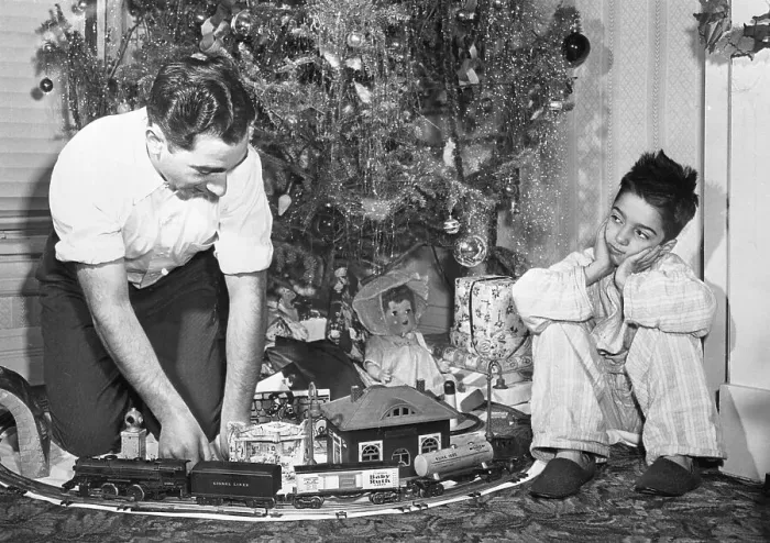 Framed Print : Boy Watches Dad Play with Train Set Framed Print : Boy Watches Dad Play with Train Set