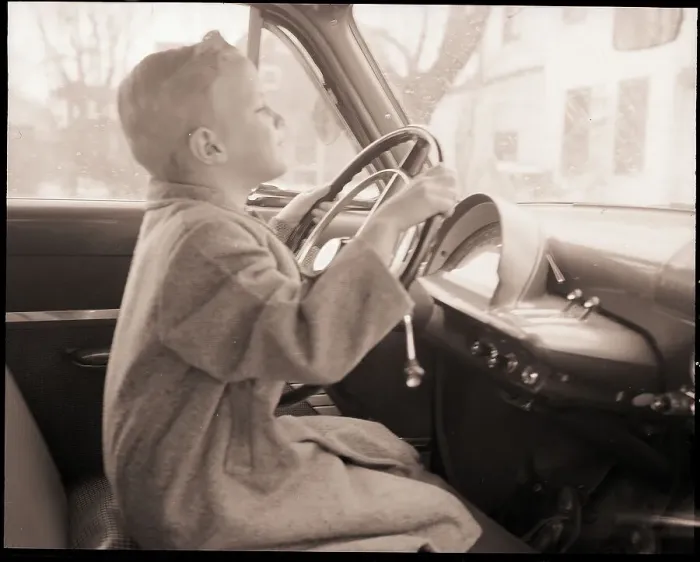 Framed Print : Boy at Wheel of Auto