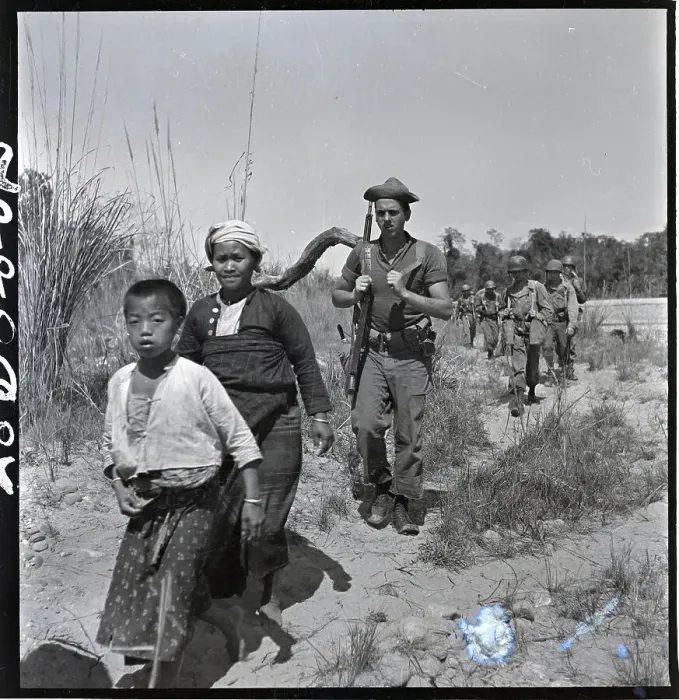 Framed Print : Boy, Woman In Front Of Line Of Troops