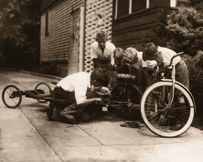 Framed Print : Four boys (10-13) building go-cart (B&W sepia tone) Framed Print : Four boys (10-13) building go-cart (B&W sepia tone)