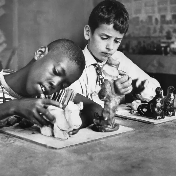 Framed Print : Two boys (6-7) playing with figurines