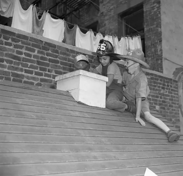 Framed Print : Boys (6-7) wearing firemen hats on roof Framed Print : Boys (6-7) wearing firemen hats on roof