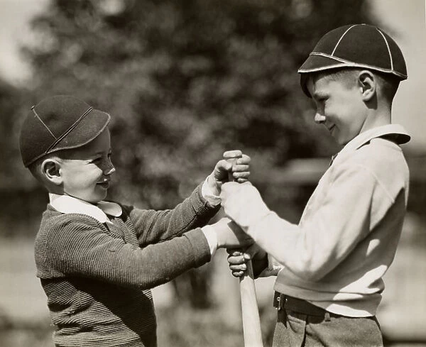 Two boys with baseball bat