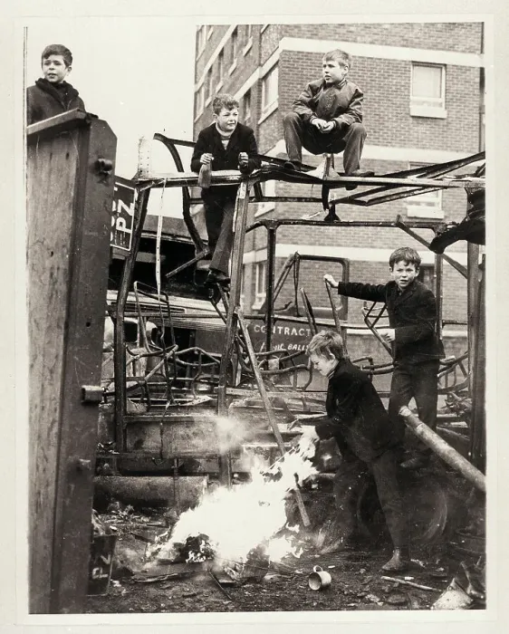 Framed Print : Boys Climb on Burnt Out Automobile Framed Print : Boys Climb on Burnt Out Automobile