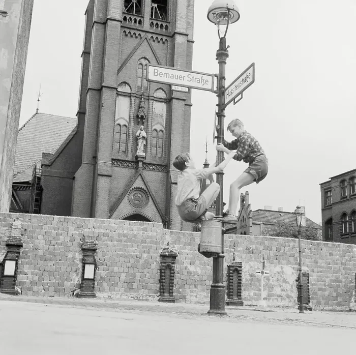 Framed Print : Boys Climbing a Light Post Framed Print : Boys Climbing a Light Post
