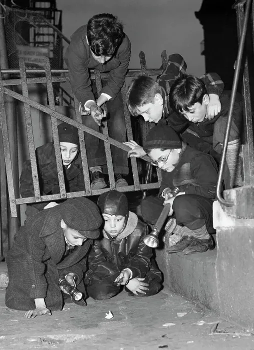 Framed Print : Boys Examine Paper on the Street Framed Print : Boys Examine Paper on the Street
