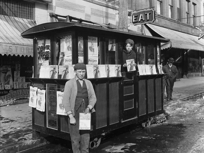 Framed Print : Two Boys Holding Magazines at Newsstand