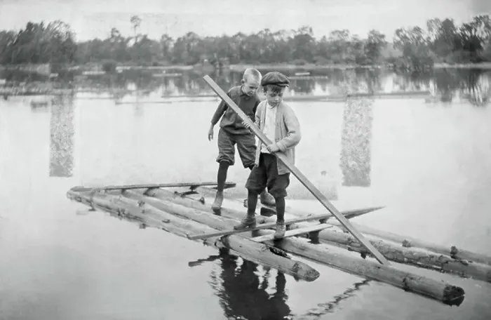 Framed Print : Two Boys on Their Homemade Log Raft Framed Print : Two Boys on Their Homemade Log Raft