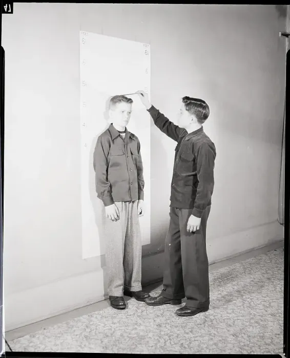 Framed Print : Boys Measuring Each Other