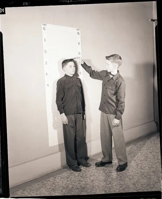 Framed Print : Boys Measuring Height Framed Print : Boys Measuring Height
