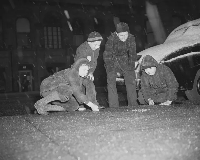 Framed Print : Boys Play Marbles Under Falling Snow Framed Print : Boys Play Marbles Under Falling Snow