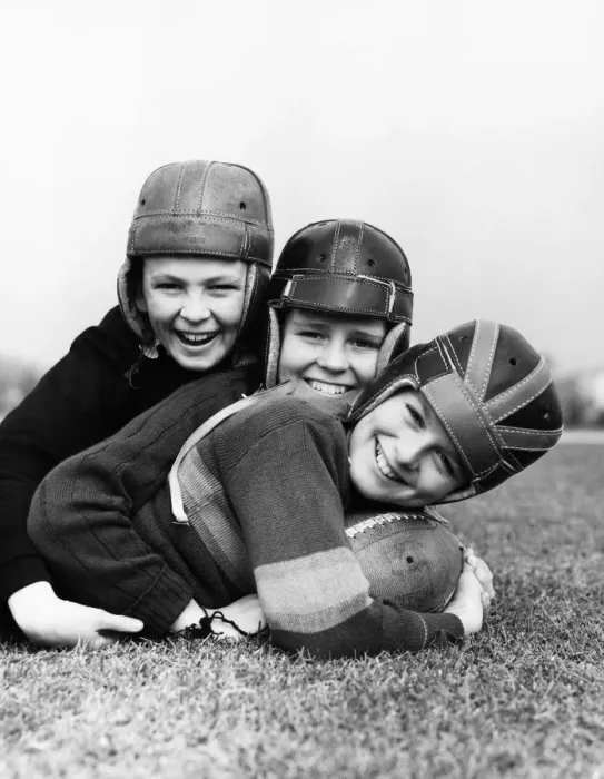 Framed Print : Three boys playing American football Framed Print : Three boys playing American football