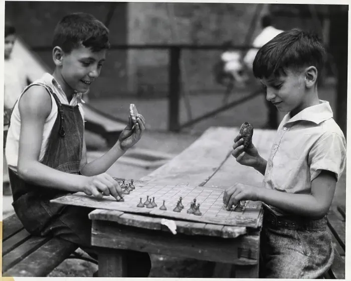 Framed Print : Boys Playing Game and Eating Cookies Framed Print : Boys Playing Game and Eating Cookies