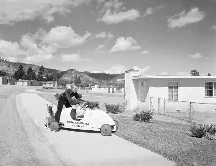 Framed Print : Two Boys Playing with Soap Box Car Outside Home
