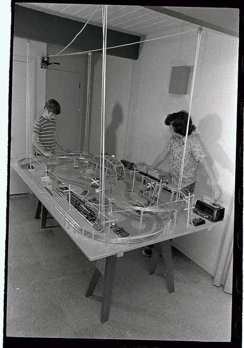 Framed Print : Boys Playing with Suspended Train Set Framed Print : Boys Playing with Suspended Train Set