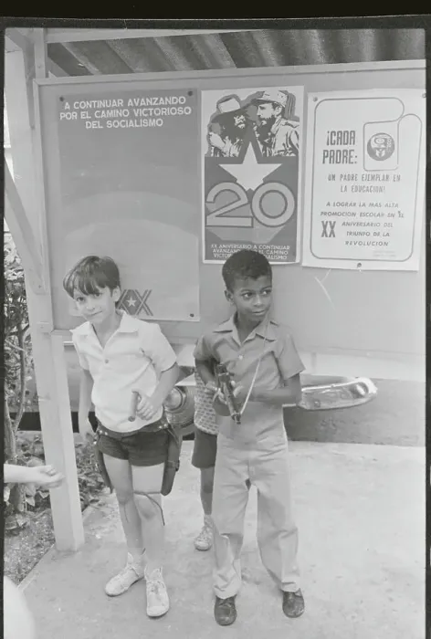 Framed Print : Boys in Front of Street Signs on Fidel Castro Rule Framed Print : Boys in Front of Street Signs on Fidel Castro Rule