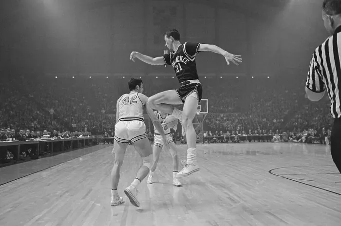 Framed Print : Bill Bradley Making Pass Under Legs of Jim Benedict Framed Print : Bill Bradley Making Pass Under Legs of Jim Benedict