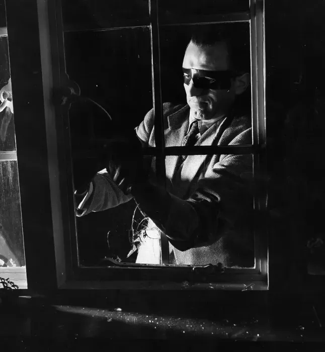Framed Print : Break-In. 20th May 1950: A man dressed as a burglar breaking into a house via a window Framed Print : Break-In. 20th May 1950: A man dressed as a burglar breaking into a house via a window