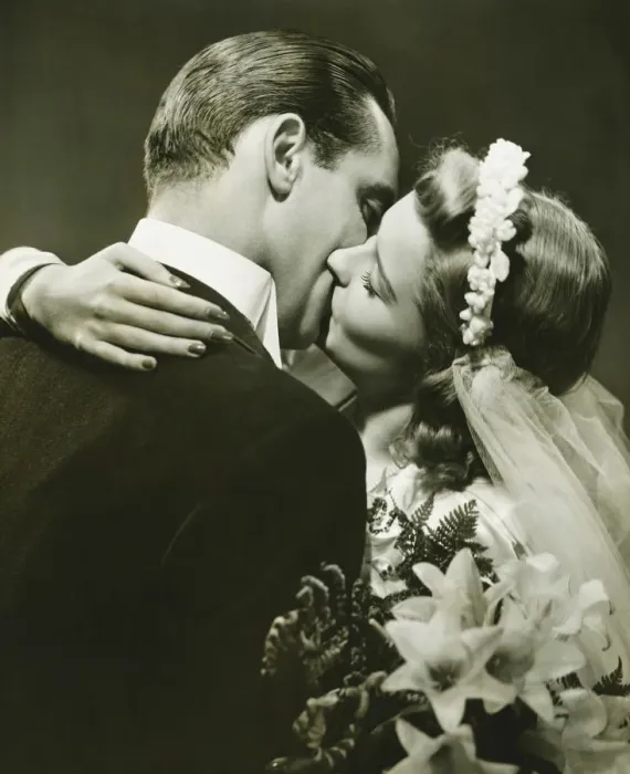 Framed Print : Bride and Groom kissing in studio, (B&W)