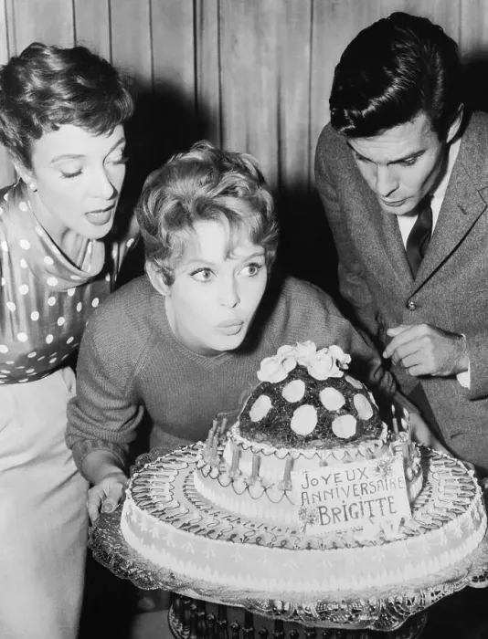 Framed Print : Brigitte Bardot Blowing out Birthday Candles Framed Print : Brigitte Bardot Blowing out Birthday Candles