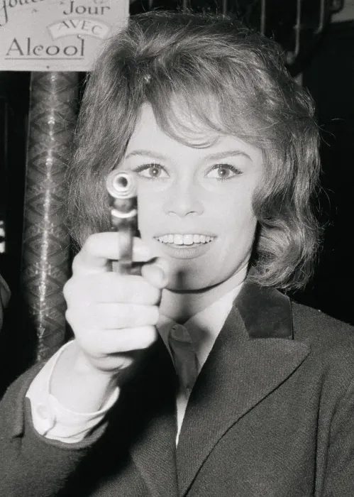 Framed Print : Brigitte Bardot Holding a Gun Framed Print : Brigitte Bardot Holding a Gun